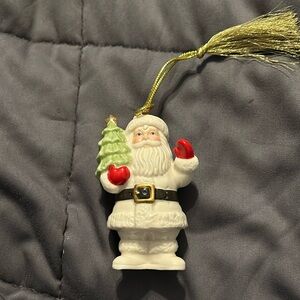 Lenox Christmas ornament. waving Santa hold Christmas tree.